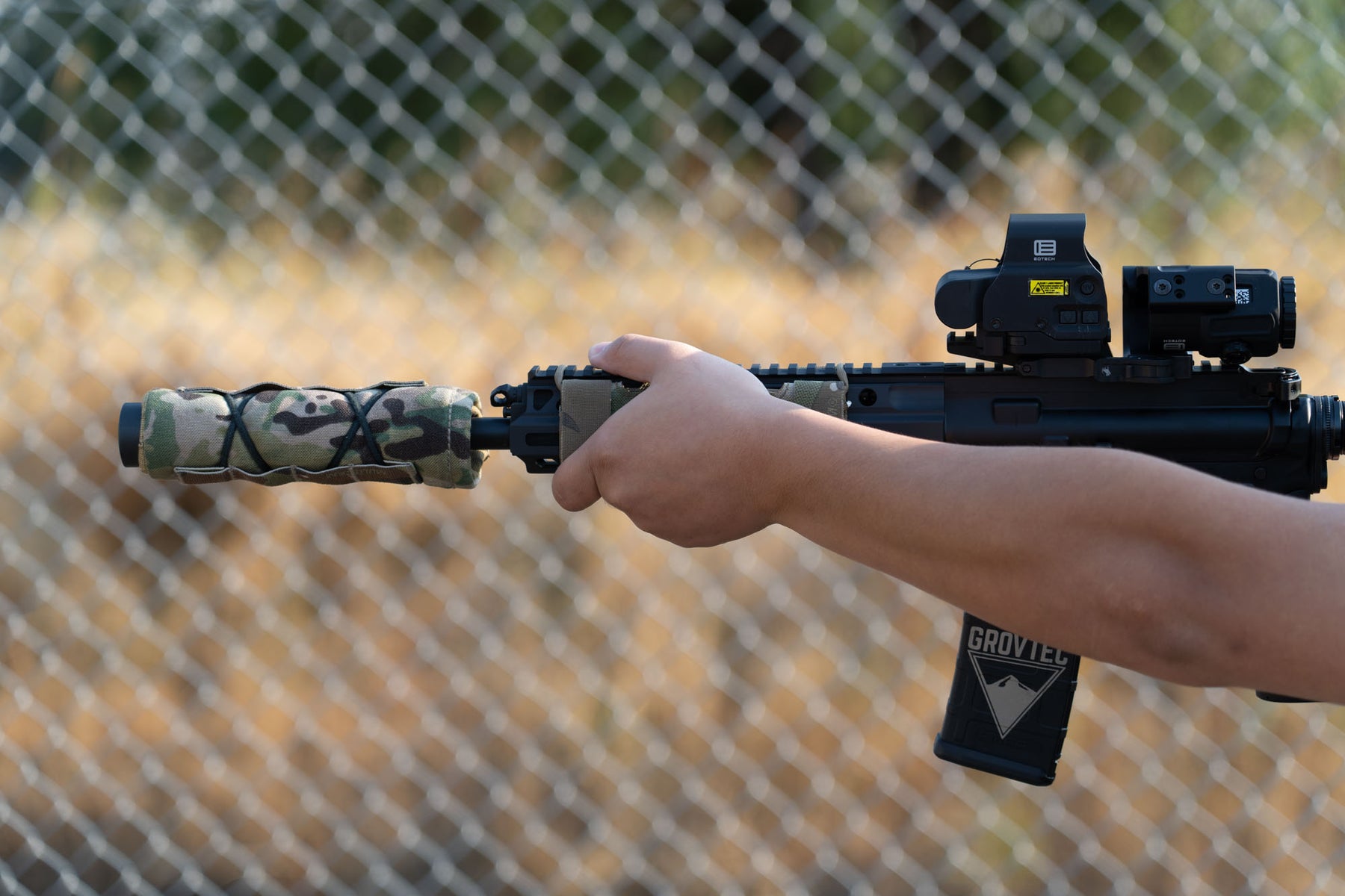 a person is holding a baseball bat in the air 