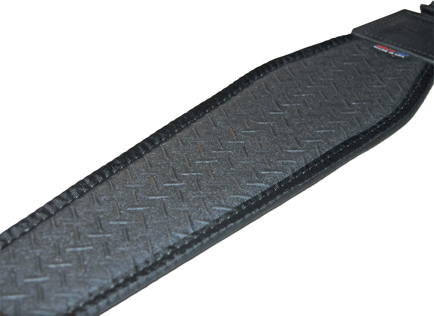 a close up of a knife on a piece of wood