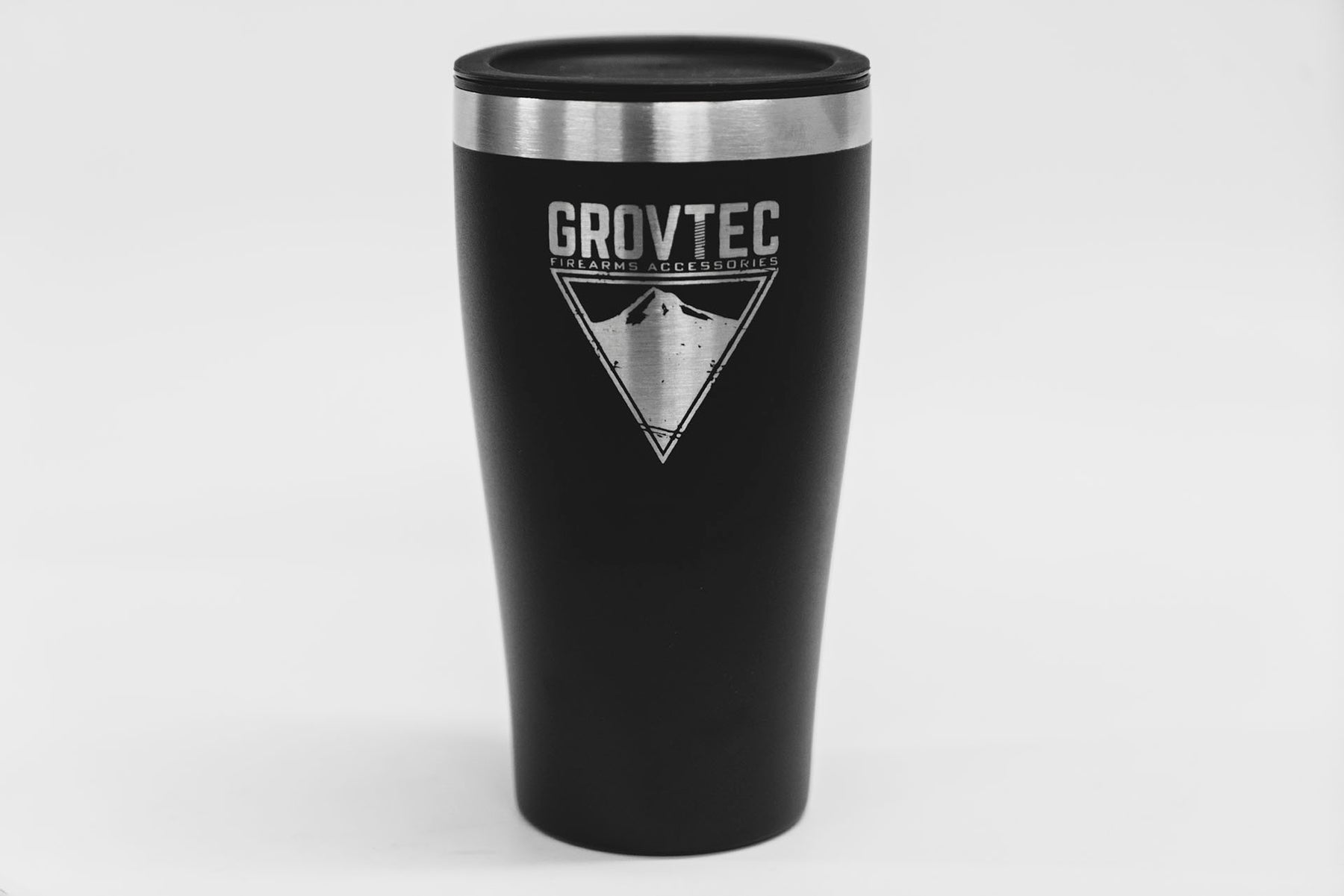 a coffee cup sitting next to a black coffee cup