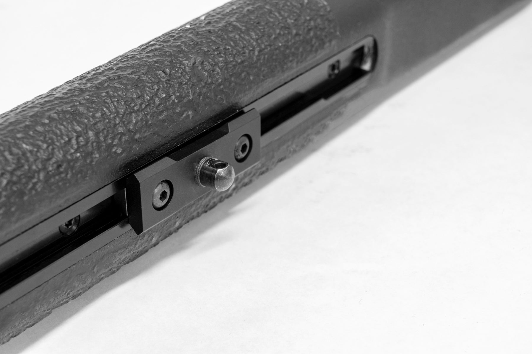 a black piece of luggage sitting on a conveyor belt 